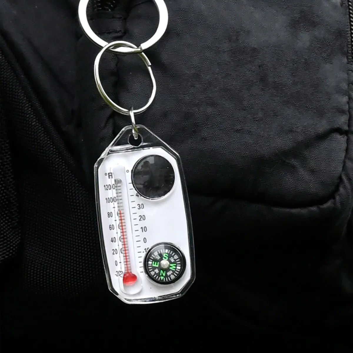 Компактний аксесуар з компасом, термометром і лупою